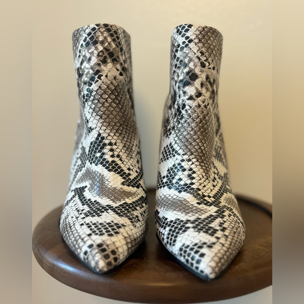 Faux snakeskin boots. 4 inch heel and zipper in the back.